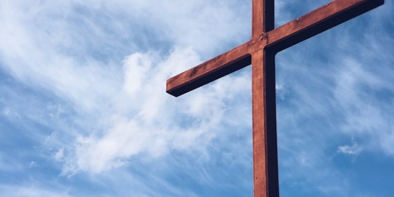 Photo by Aaron Burden a brown wooden cross