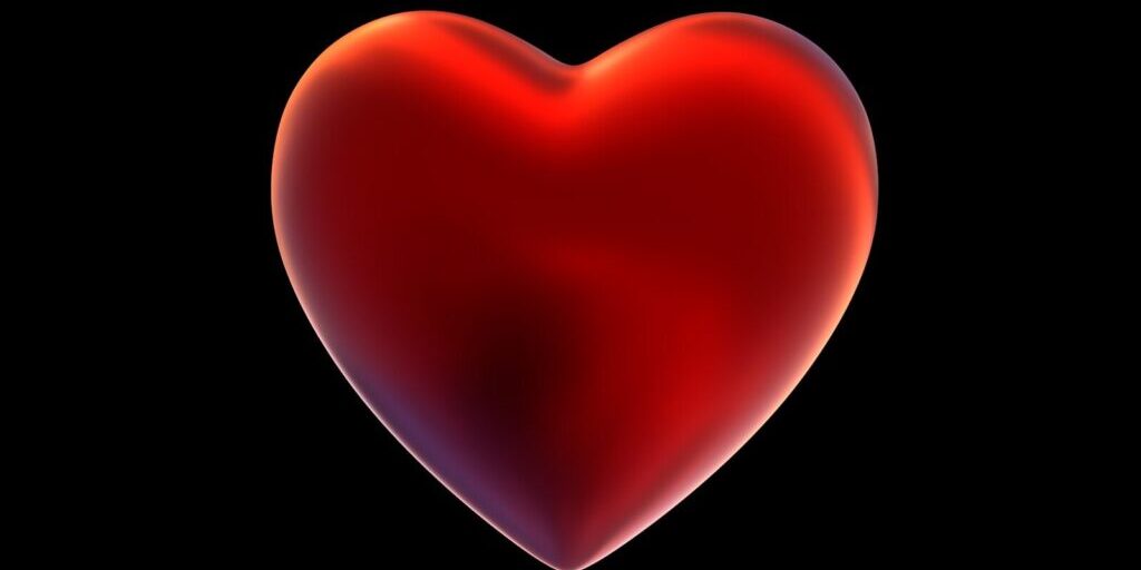 A red heart on a black background