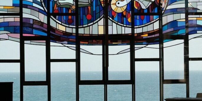 A large stained glass window in a church