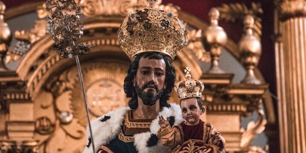 gold and white hindu deity figurine