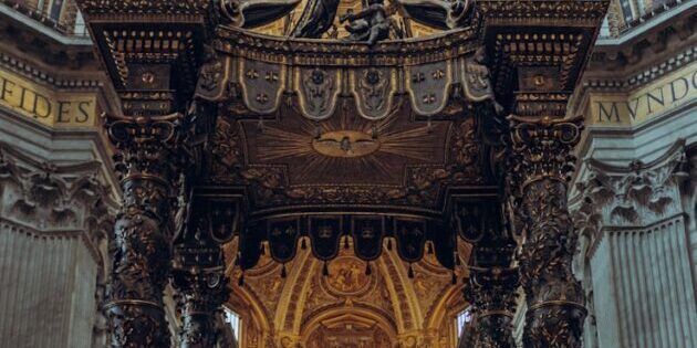 photo by artem lobastov a large cathedral with a statue of a man on the alter